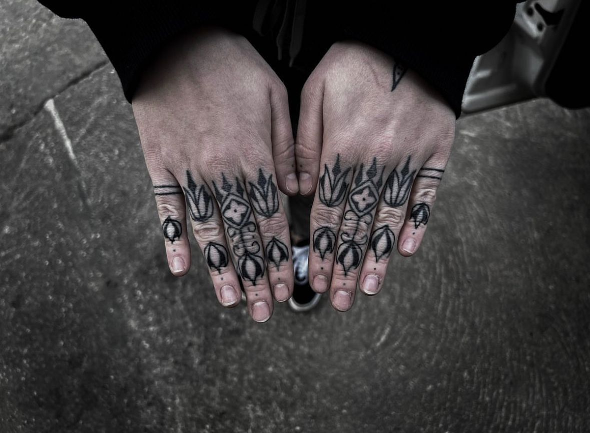 a person with cover-up tattoos on their hands, zwickau, germany