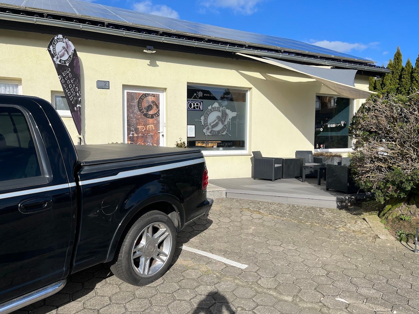 a truck parked in front of a building