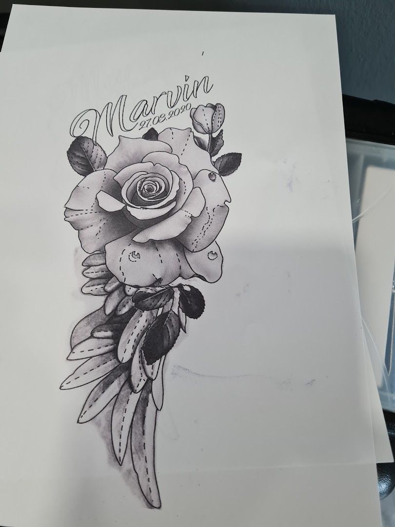 a drawing of a rose with the word mom