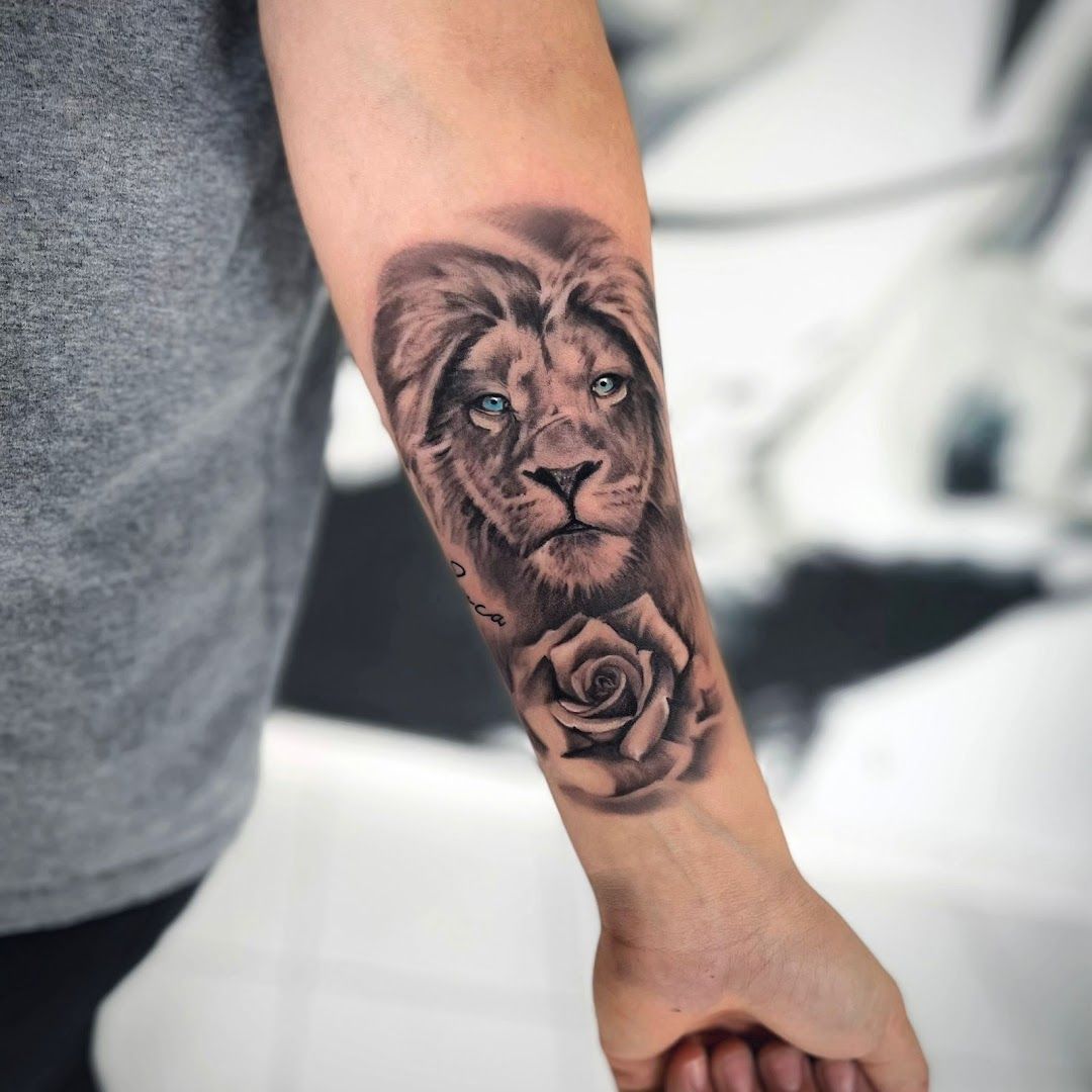a lion blackwork tattoo on the arm, zollernalbkreis, germany