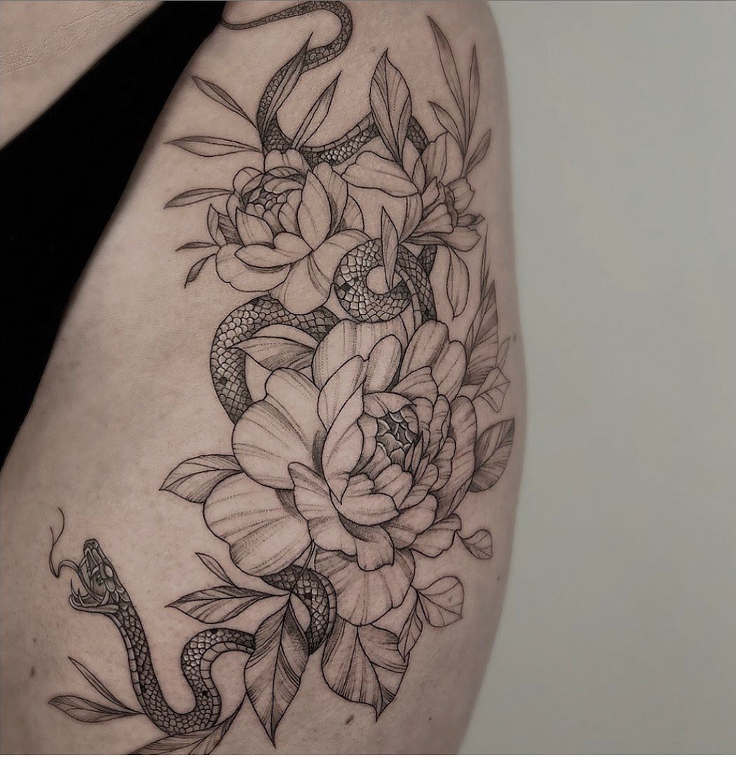 a black and white narben tattoo design of a snake and flowers, bayreuth, germany