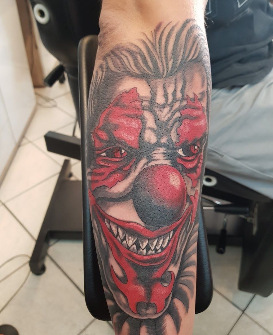 a aquarell tattoos of a clown with a red nose and a black and grey background, hamburg, germany