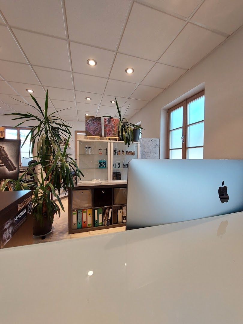 a white desk with a laptop on it