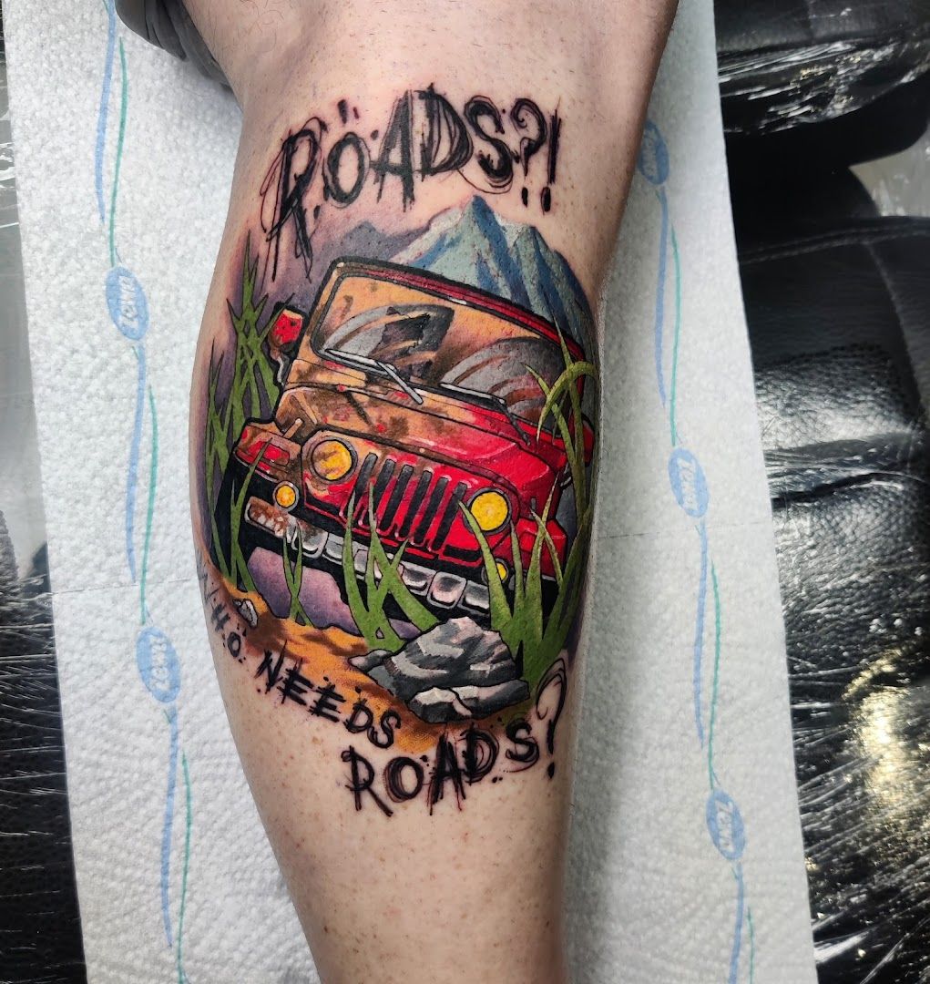 a cover-up tattoo of a car with the words road ahead, berlin, germany