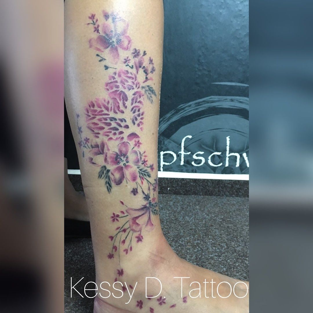 a cover-up tattoo with flowers on the leg, barnim, germany