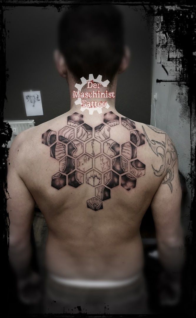 a man with a cover-up tattoo on his back, kreisfreie stadt gera, germany