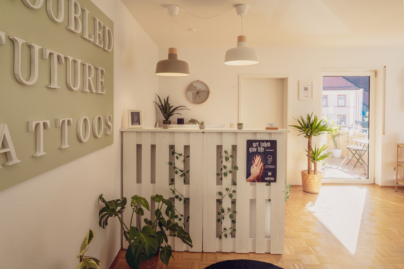 a room with a white wall and a wooden floor