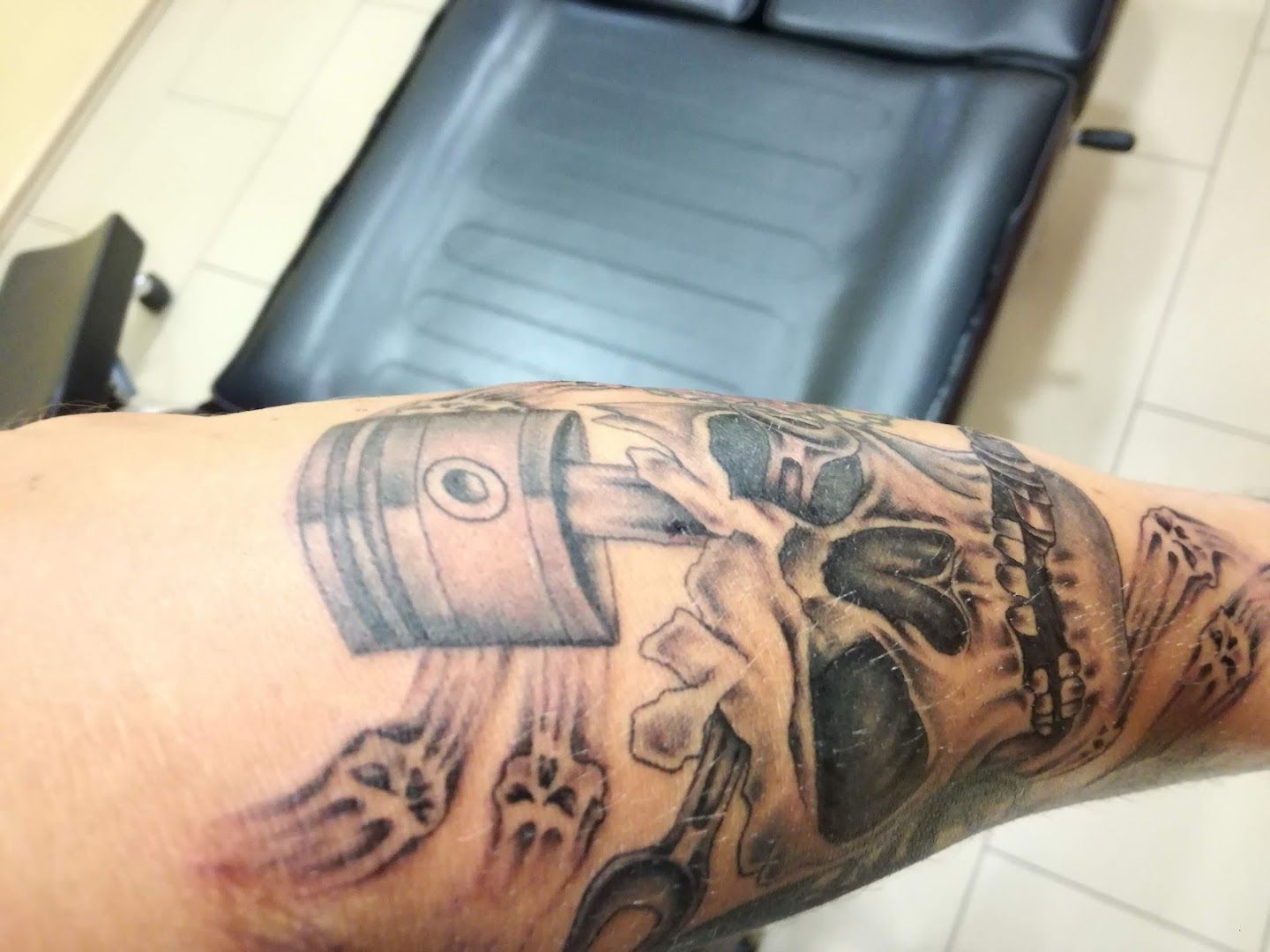 a narben tattoo of a man's arm with a skull and a skull on it, steinfurt, germany