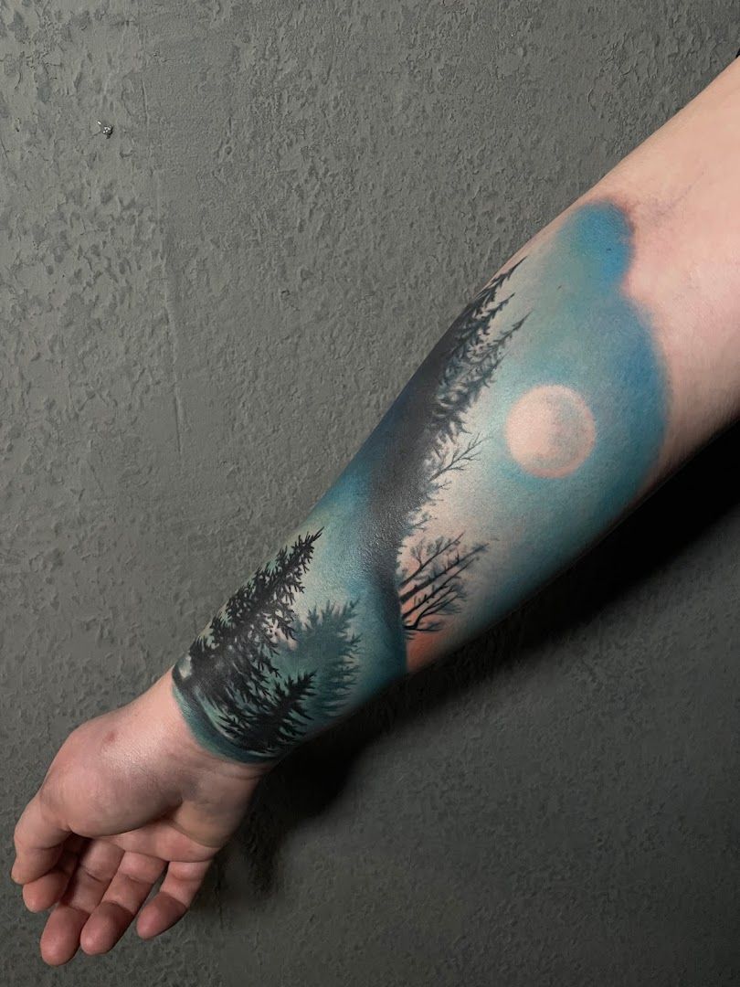 a cover-up tattoo with trees and a moon in the sky, karlsruhe, germany