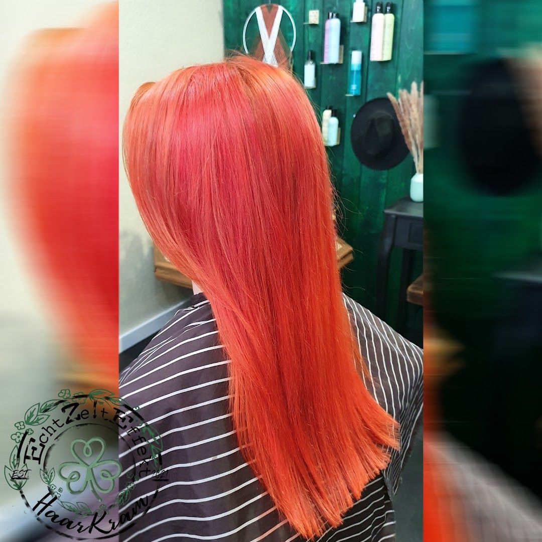 a woman with long red hair in a salon