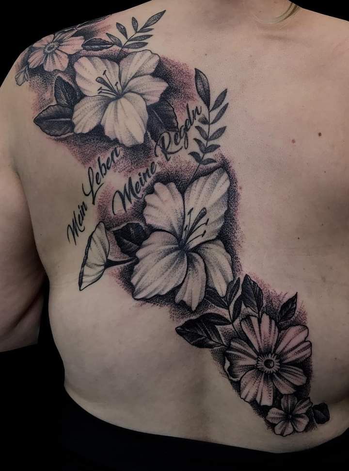 a black and white cover-up tattoo design with flowers, teltow-fläming, germany