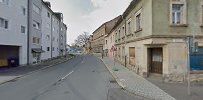 the street in front of the house is empty