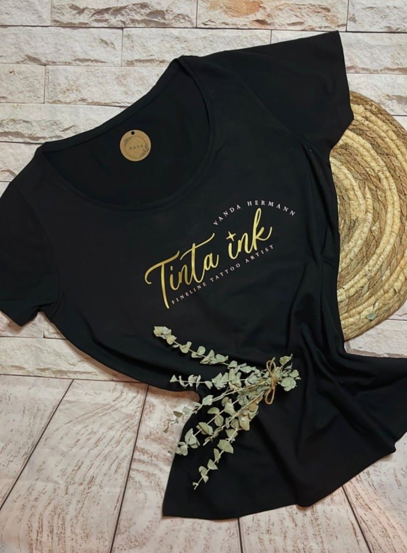 a black shirt with gold lettering that says,'thank '