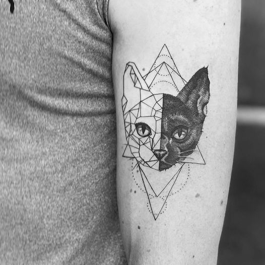 a black and white cat blackwork tattoo on the left arm, nürnberg, germany