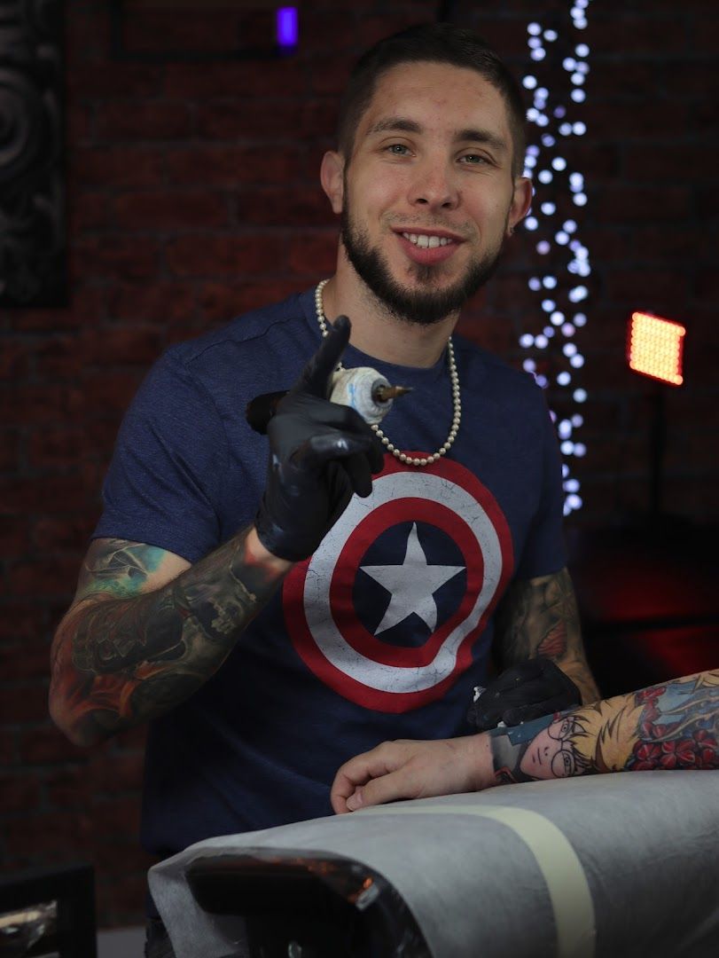 a man with narben tattoos and a captain shirt, bremen, germany