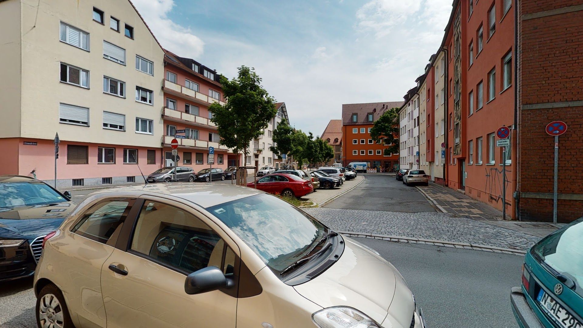 a small car parked on the side of a street