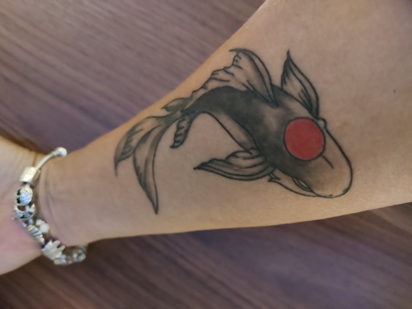 a japanische tattoos in leipzig of a koi fish on the wrist, nürnberg, germany