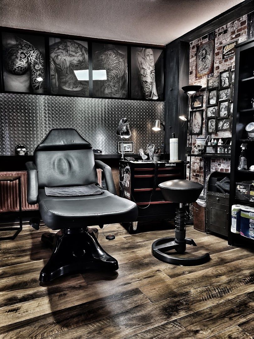 a room with a chair, desk and shelves