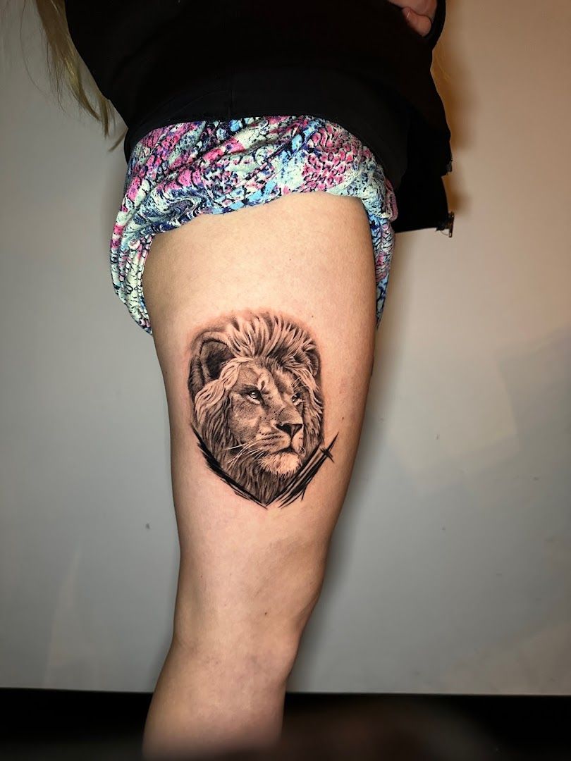 a japanische tattoos in leipzig of a lion on the thigh, kassel, germany