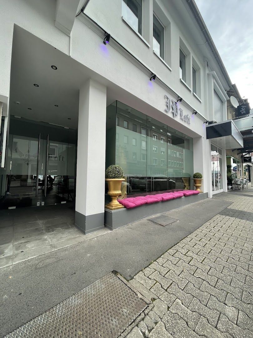 the building has a pink couch outside