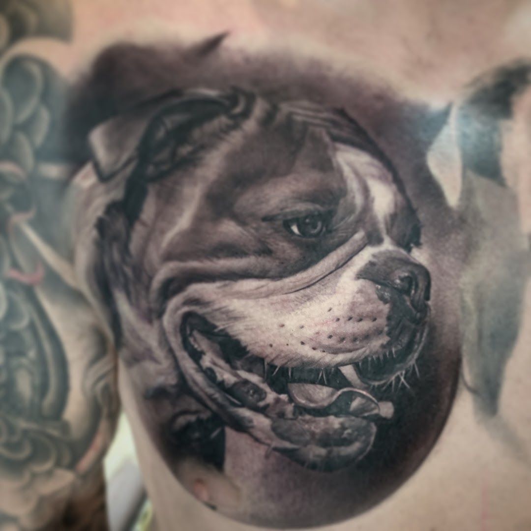 a cover-up tattoo of a dog on the chest, salzlandkreis, germany