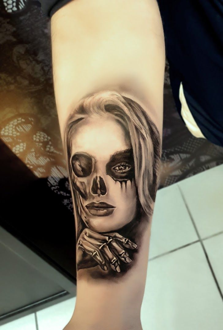 a woman with a skull cover-up tattoo on her arm, kreisfreie stadt osnabrück, germany