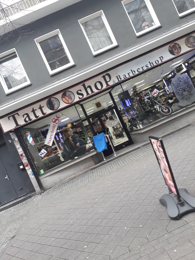 a person walking down a sidewalk in front of a store