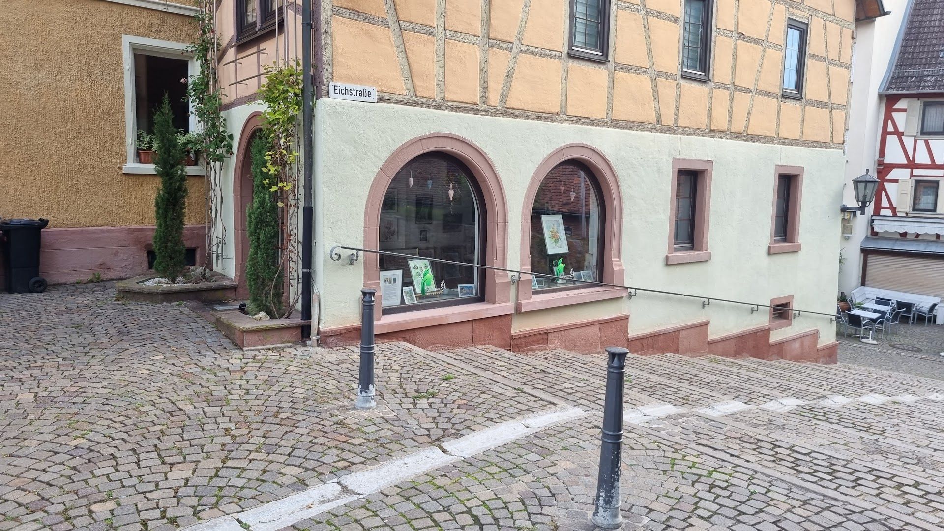 a building with a sign that says,'the house is in the middle of the street