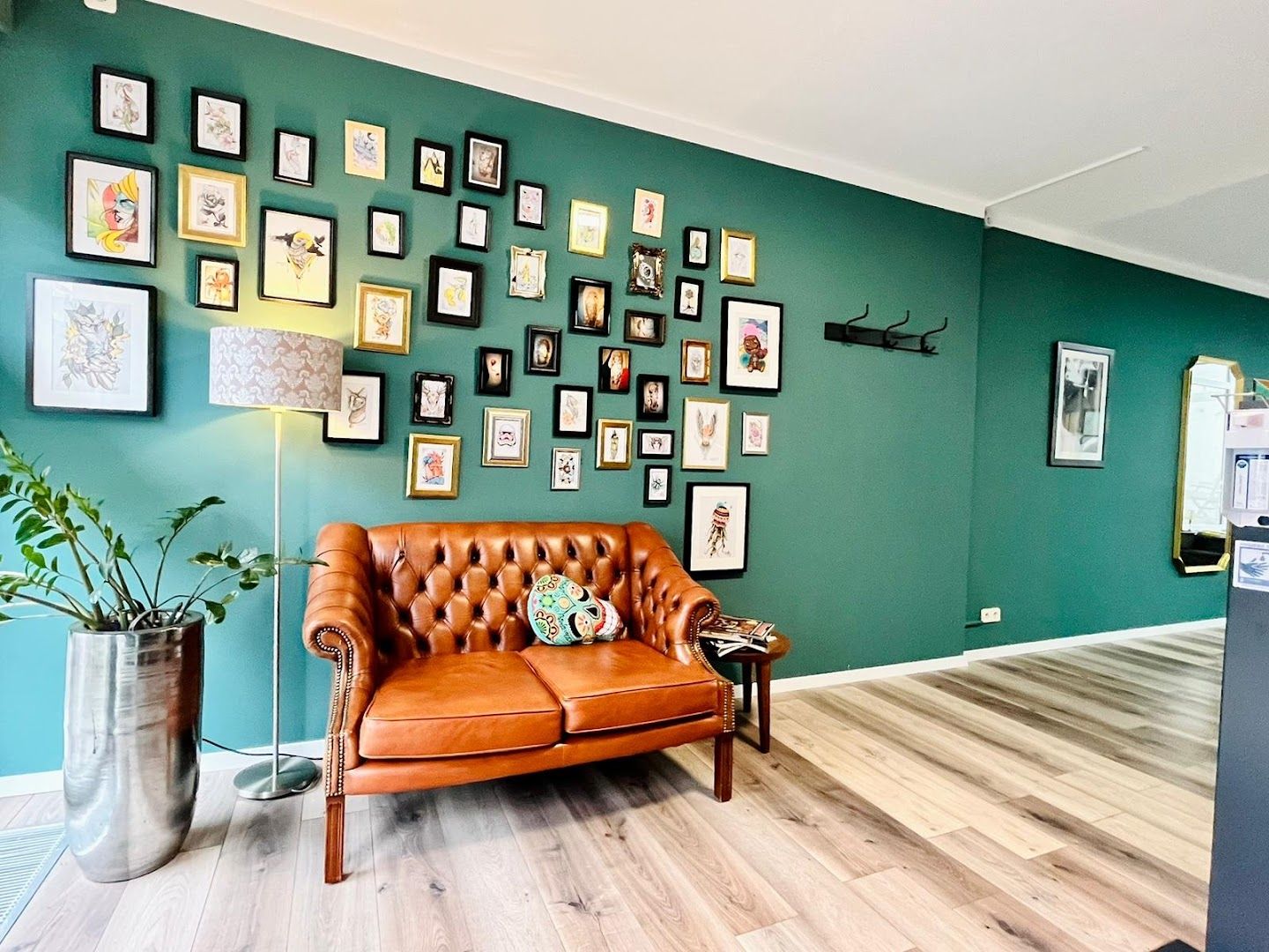 a living room with a couch and pictures on the wall