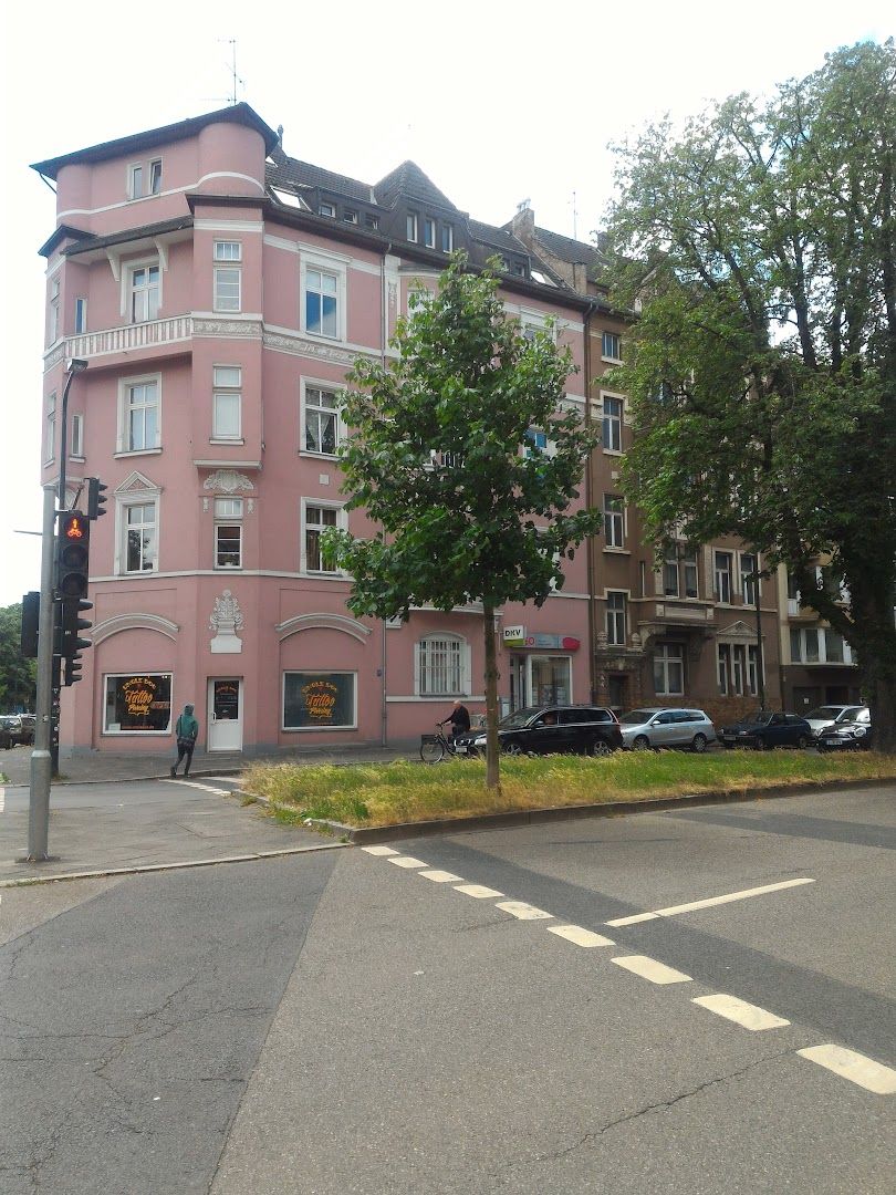 a pink building with a white stripe