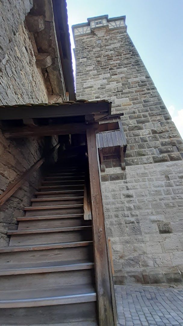 a stone building with stairs going up to the top