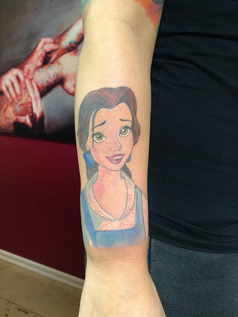 a woman's arm with a cover-up tattoo of a woman's face, bochum, germany