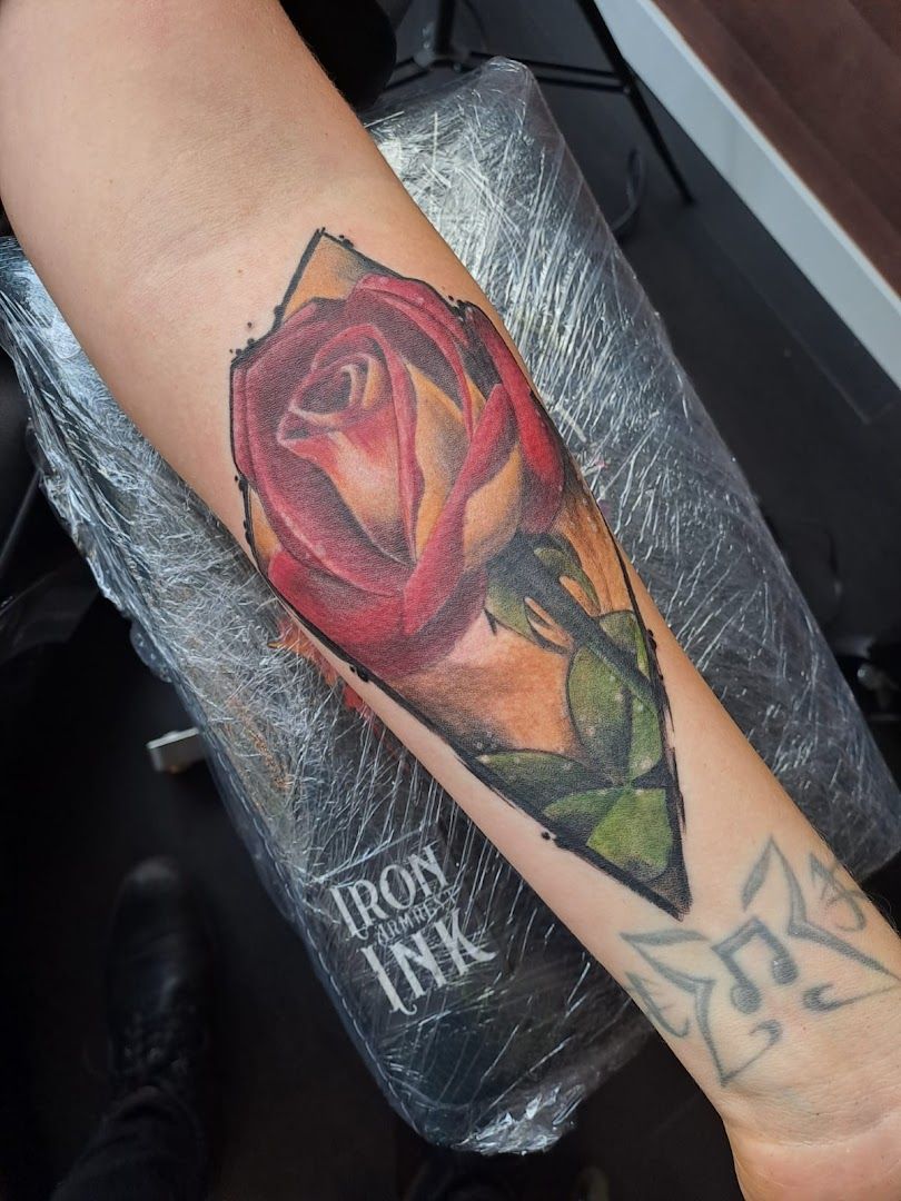 a rose cover-up tattoo on the arm, berlin, germany