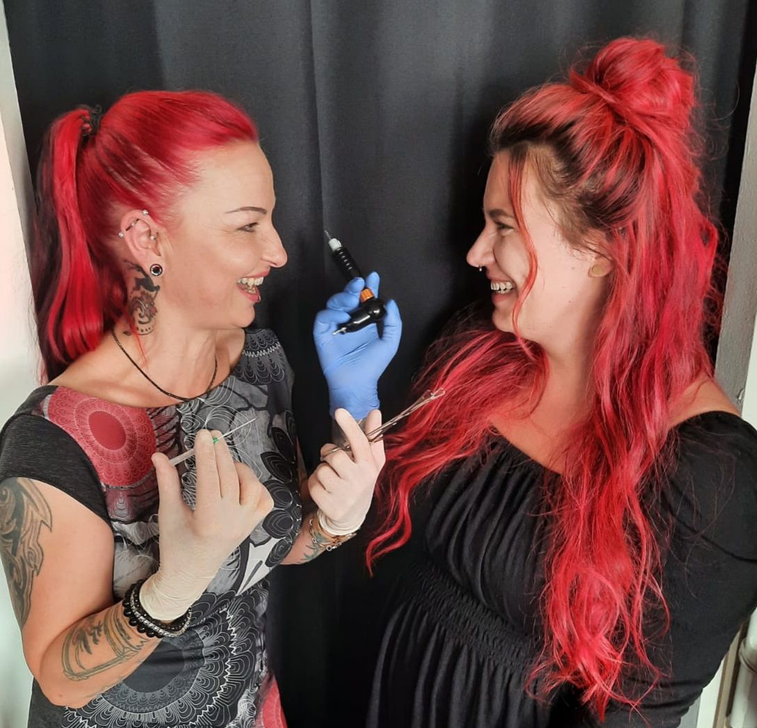 two women with red hair and narben tattoos, vorpommern-greifswald, germany