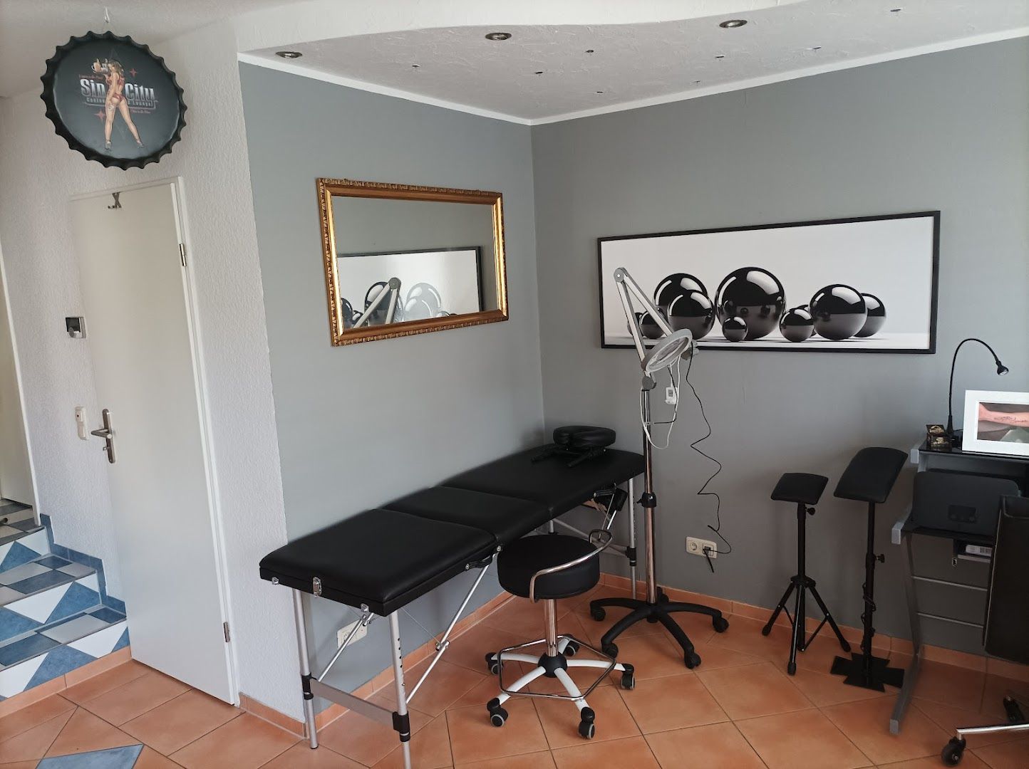 a salon room with a chair and a mirror