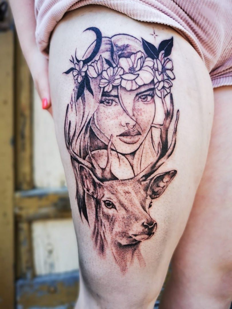 a narben tattoo of a deer with flowers on its head, biberach, germany