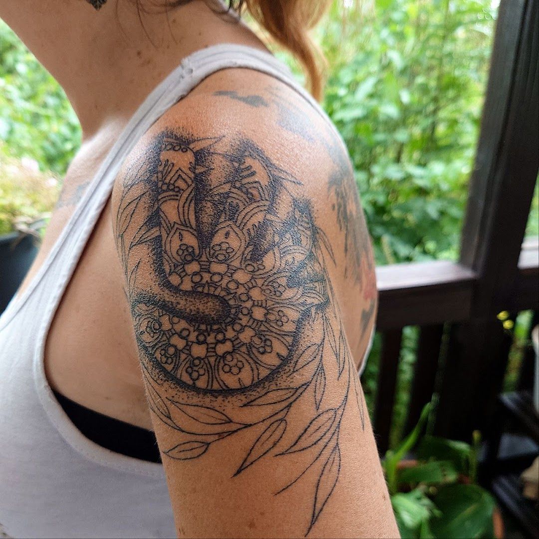 a woman with a cover-up tattoo on her shoulder, neuburg-schrobenhausen, germany