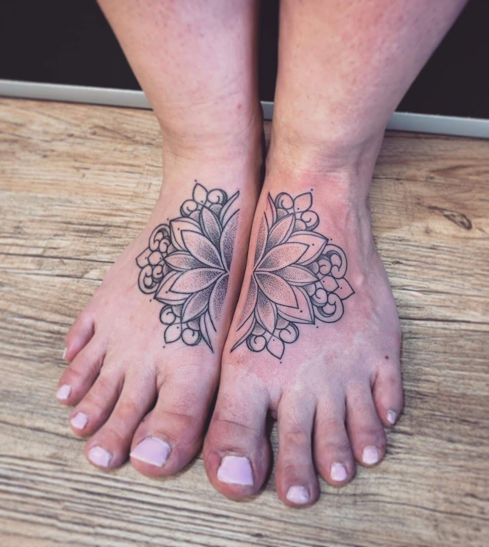 a woman's foot with a flower narben tattoo on it, saale-orla-kreis, germany