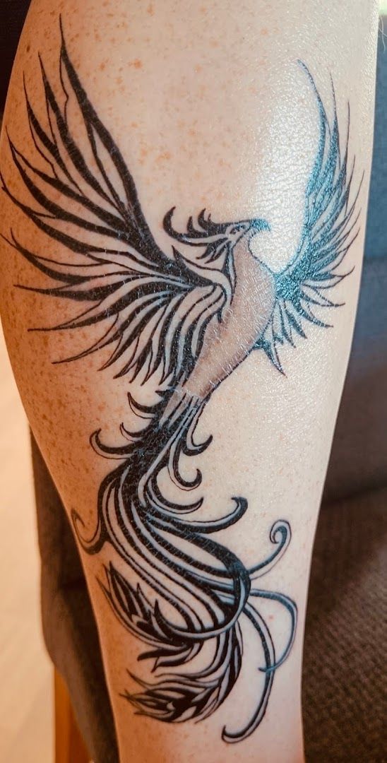 a totenkopf tattoos design on the leg of a woman, saale-orla-kreis, germany