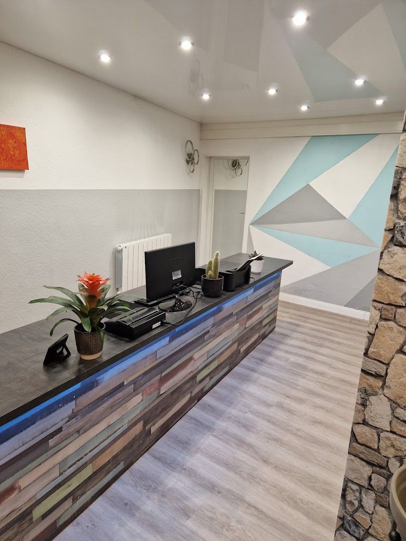 a reception area with a stone wall and a stone wall