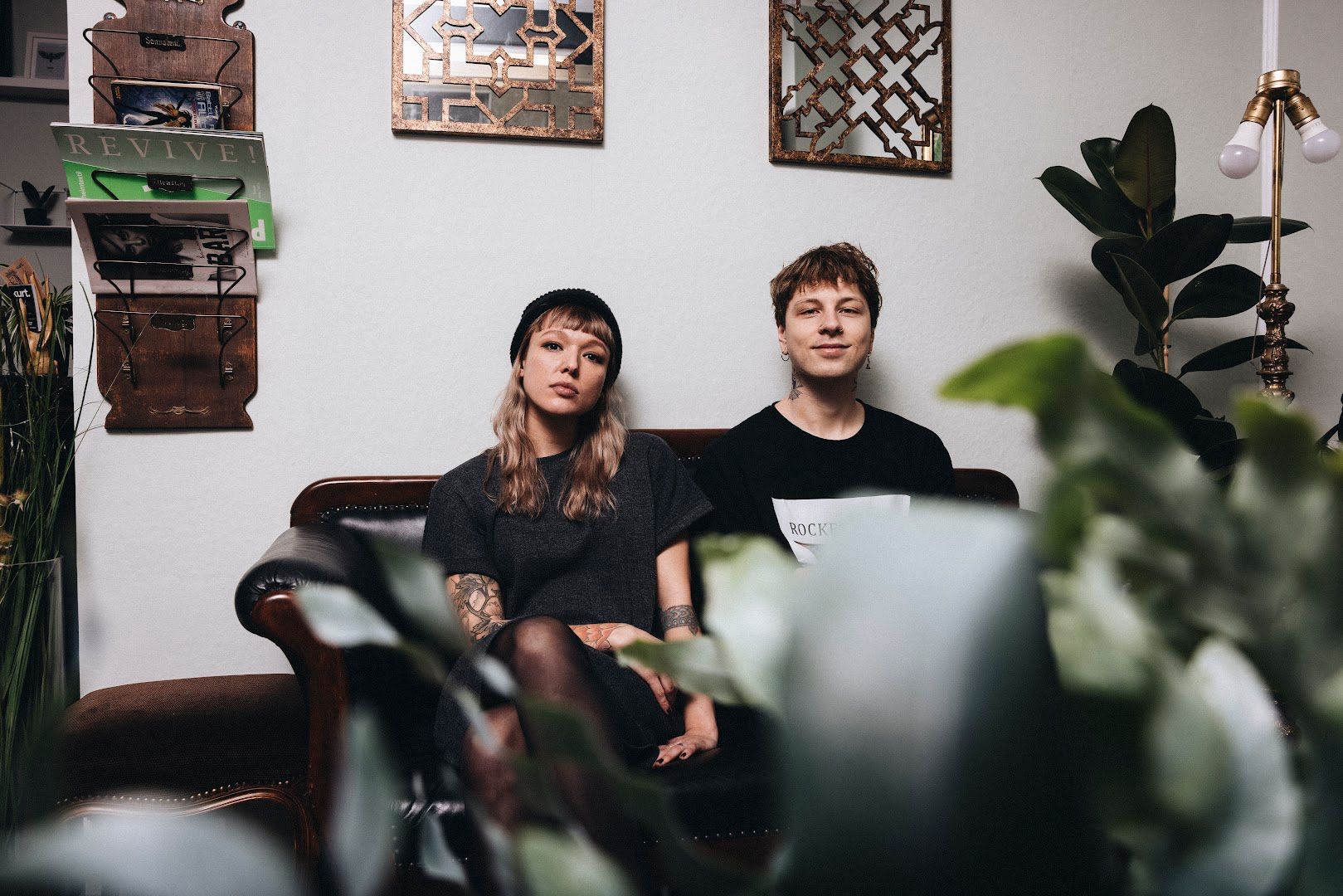 a man and woman sitting on a couch