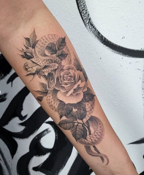 a black and white narben tattoo with roses on the forearm, bodenseekreis, germany