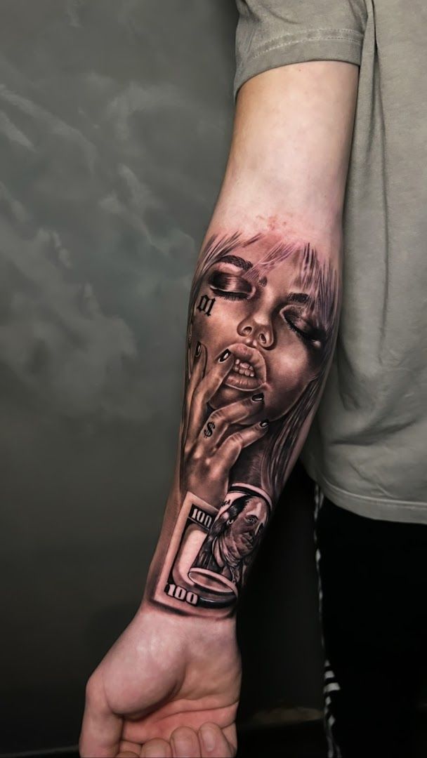 a man's arm with a cover-up tattoo of a woman's face, karlsruhe, germany