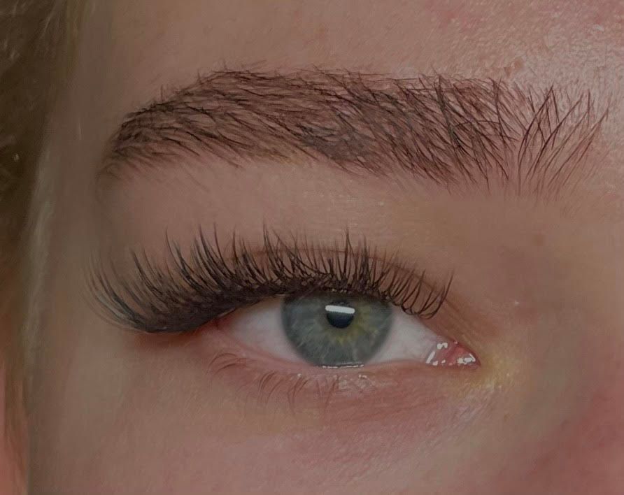 a woman with long eyelashes and long lashes