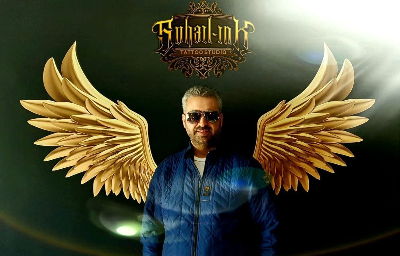 a man with wings on his head