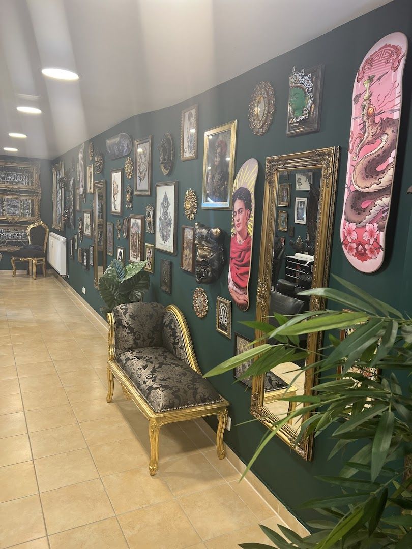 a room with a large wall full of art