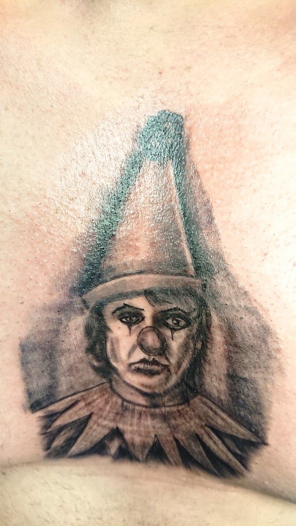 a japanische tattoos in leipzig of a man with a hat and a hood, neumarkt, germany