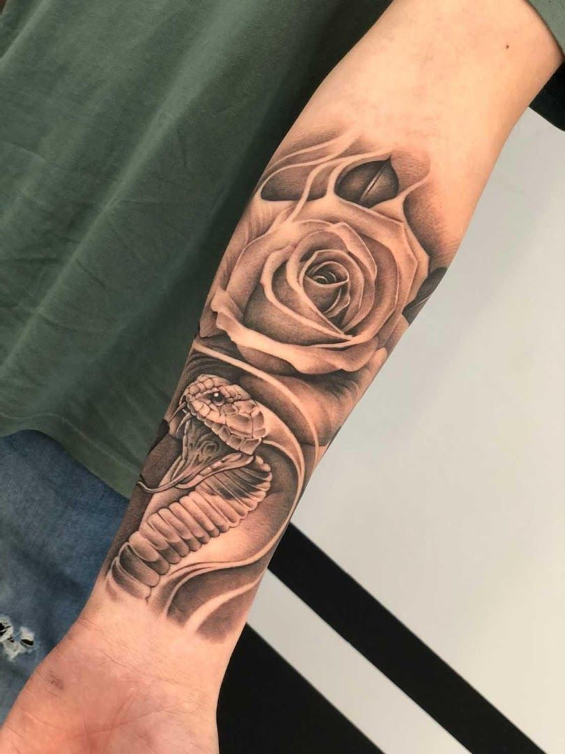 a black and white rose cover-up tattoo on the forearm, berlin, germany