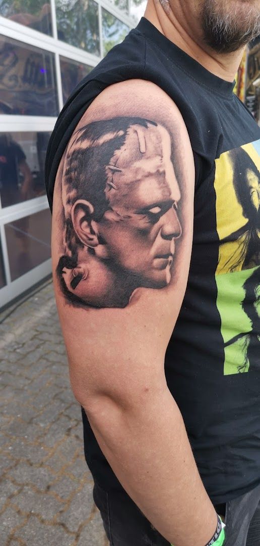 a man with a cover-up tattoo on his arm, kreisfreie stadt heilbronn, germany