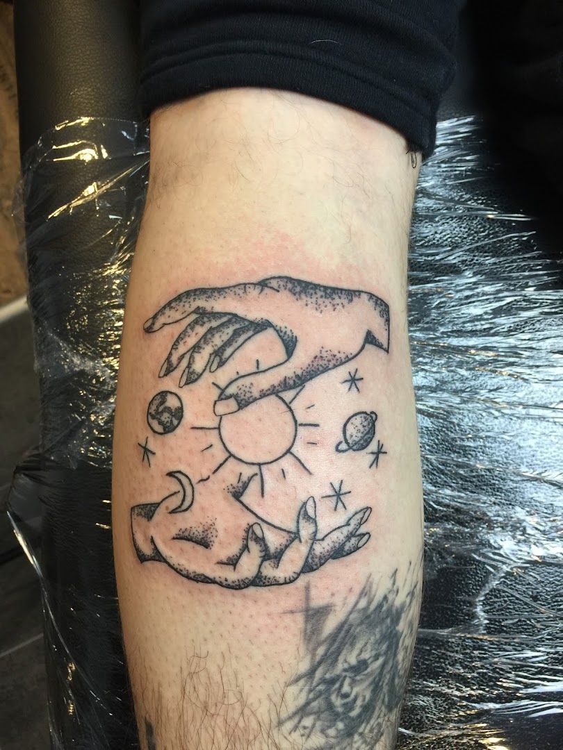 a blackwork tattoo of a man's hands with a tattoo of a dog and a cat, böblingen, germany